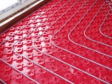 Underfloor heating pipes provide an alternative to traditional central heating radiators for homes in Newport